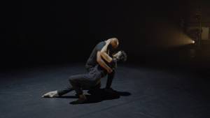 A male dancer holding a female dancer in a dip