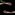 A black background with two arms reaching towards the centre. They have pale skin and relaxed hands.