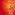 A red background with one ballet dancer en pointe. She is wearing a red tutu with gold feathers and a matching headdress.