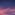 A sky at dusk with a mix of pink and blue clouds.
