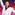 A disco dance floor full of dancers, front and centre a man dressed in a white tux posing with his arm pointed up