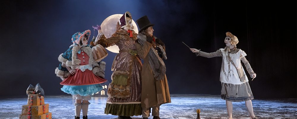 The Little Match Girl On a snowy winter night, three dancers, the Donnarumma family stand together looking to the right at the little match girl who is wearing a white bonnet and pinafore and is holding out a match.