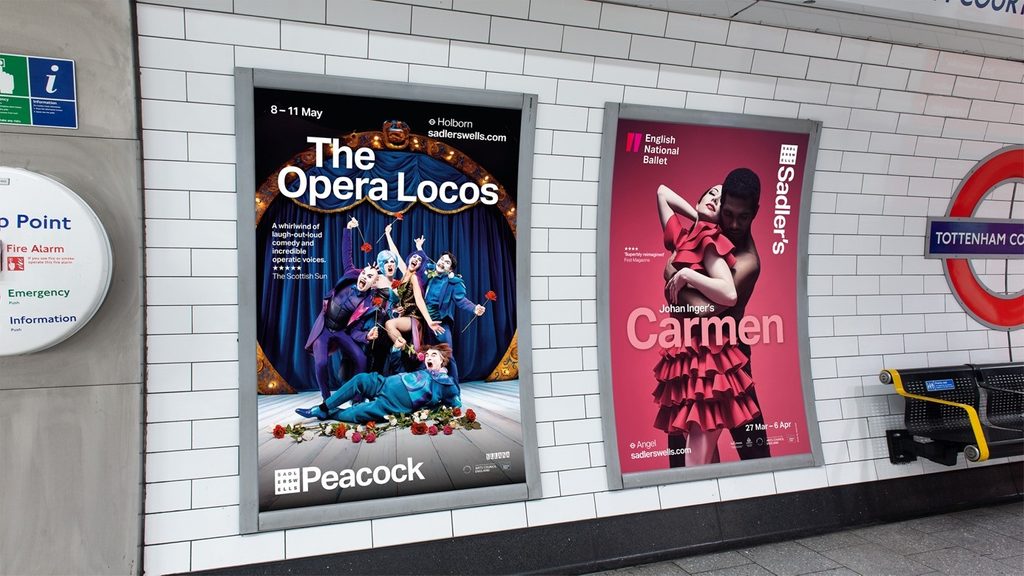 Two Sadler's Wells posters in a Tube tunnel