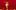 Chicos Mambos - TUTU A person wearing a large, peach-colored tutu dances on a stage with red and yellow floral decorations against a red background.